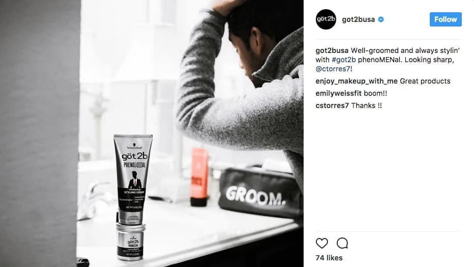 Social media post: man touching his hair at a bathroom counter beside Got2b styling cream and a bag printed "GROOM."