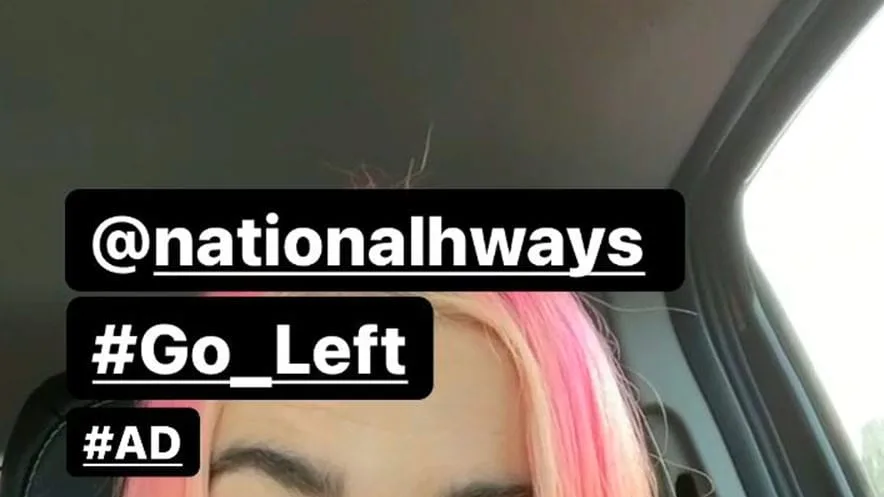 A screenshot from Eliza Fudge's content of them in a car talking to the audience.